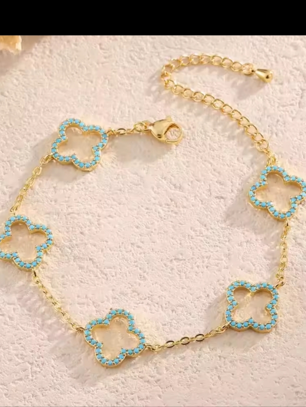 blue and gold clover bracelet